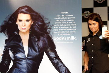 INDIANAPOLIS - MAY 07:  Danica Patrick driver of the #7 Motorola Andretti Green Racing Dallara Honda poses with some milk beside her new 'Got Milk?' ad campaign poster before practice for the IRL IndyCar Series 93rd running of the Indianapolis 500 on May 7, 2009 at Indianapolis Motor Speedway in Indianapolis, indiana.  (Photo by Jonathan Ferrey/Getty Images)