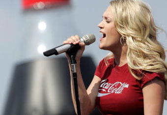CONCORD, NC - MAY 28:  Country singer Carrie Underwood performs before the NASCAR Nextel Cup Series Coca-Cola 600 at the Lowe's Motor Speedway on May 28, 2006 in Concord, North Carolina.  (Photo by Chris Graythen/Getty Images for NASCAR)