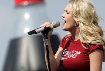 CONCORD, NC - MAY 28:  Country singer Carrie Underwood performs before the NASCAR Nextel Cup Series Coca-Cola 600 at the Lowe's Motor Speedway on May 28, 2006 in Concord, North Carolina.  (Photo by Chris Graythen/Getty Images for NASCAR)