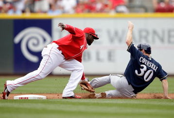 CINCINNATI - JULY 19:  Brandon Phillips #4 of the Cincinnati Reds tags out Craig Counsell #30 of the Milwaukee Brewers as Counsell was trying to steal second base during the game at Great American Ball Park on July 19, 2009 in Cincinnati, Ohio.  (Photo by Andy Lyons/Getty Images)