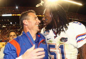 MIAMI - JANUARY 08:  Head coach Urban Meyer of the Florida Gators celebrates with Brandon Spikes #51 their win over the Oklahoma Sooners after the FedEx BCS National Championship Game at Dolphin Stadium on January 8, 2009 in Miami, Florida.  (Photo by Donald Miralle/Getty Images)
