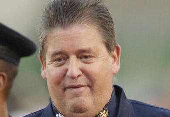 LOS ANGELES - NOVEMBER 29:  Head coach Charlie Weis of the Notre Dame Fighting Irish smiles as he walks to the locker room from the field before the game against the USC Trojans on November 29, 2008 at the Los Angeles Memorial Coliseum in Los Angeles, California.  USC won 38-3.  (Photo by Jeff Golden/Getty Images)
