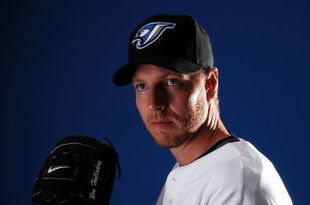 DUNEDIN, FL - FEBRUARY 22:  Pitcher Roy Halladay #32 of the Toronto Blue Jays poses for a photo on media day during spring training at the Bobboy Mattix Traing Center February 22, 2008 in Dunedin, Florida.  (Photo by Marc Serota/Getty Images)
