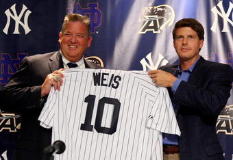NEW YORK - JULY 20:  Notre Dame head coach Charlie Weiss and New York Yankees Managing General Partner Hal Steinbrenner pose for a photograph during a press conference announcing that Yankee Stadium will play host to the 2010 Notre Dame v Army college football game on July 20, 2009 at Yankee Stadium in the Bronx borough of New York City. The game is to be played on November 20, 2010.  (Photo by Jim McIsaac/Getty Images)