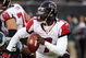 PHILADELPHIA - DECEMBER 31:  Michael Vick #7 of the Atlanta Falcons looks to pass against the Philadelphia Eagles in NFL action December 31, 2006 at Lincoln Financial Field in Philadelphia, Pennsylvania. The Eagles won 24-17.  (Photo by Jim McIsaac/Getty Images)