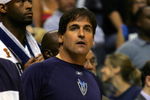 DALLAS - JUNE 20:  Owner Mark Cuban of the Dallas Mavericks looks on standing in the team bench in game six of the 2006 NBA Finals against the Miami Heat on June 20, 2006 at American Airlines Center in Dallas, Texas.  The Heat defeated the Mavericks 95-92 to win the NBA title. NOTE TO USER: User expressly acknowledges and agrees that, by downloading and or using this photograph, User is consenting to the terms and conditions of the Getty Images License Agreement.  (Photo by Stephen Dunn/Getty Images)