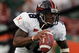 CORAL GABLES, FL - NOVEMBER 26:  Quarterback Marques Hagans #18 of the Virginia Cavaliers scrambles against the Miami Hurricanes at the Orange Bowl on November 26, 2005 in Coral Gables, Florida.  (Photo by Doug Benc/Getty Images)