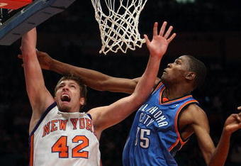 NEW YORK - NOVEMBER 14: David Lee #42 of the New York Knicks lays the ball up against Kevin Durant #35  of the Oklahoma City Thunder on November 14, 2008 at Madison Square Garden in New York City.  NOTE TO USER: User expressly acknowledges and agrees that, by downloading and or using this photograph, User is consenting to the terms and conditions of the Getty Images License Agreement.  (Photo by Nick Laham/Getty Images)