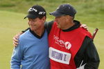 TURNBERRY, SCOTLAND - JULY 19:  Tom Watson of USA embraces his caddie Neil Oxman on the 18th green following his defeat in a playoff against Stewart Cink during the final round of the 138th Open Championship on the Ailsa Course, Turnberry Golf Club on July 19, 2009 in Turnberry, Scotland.  (Photo by Ross Kinnaird/Getty Images)