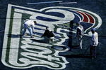 JACKSONVILLE, FL-  JANUARY 31: Members of the grounds crew paint the New England Patriots logo on the field prior to the start of Super Bowl XXXIX at Alltel Stadium on January 31, 2005 in Jacksonville, Florida. (Photo by Scott Halleran/Getty Images)