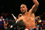NEW YORK - FEBRUARY 21: Miguel Cotto is picked up by Evangelista Cotto to celebrate his 5th round TKO over Michael Jennings in their WBO World Welterweight title bout at Madison Square Garden on February 21, 2009 in New York City.  (Photo by Chris Trotman/Getty Images)