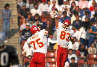 LOS ANGELES - 1986:  Wide receiver Stephone Paige #83 and Irv Eatman #75 of the Kansas City Chiefs celebrate with a high five during a 1986 NFL game against the Los Angeles Raiders at the LA Memorial Coliseum in Los Angeles, California.  The Raiders defeated the Chargers 17-13.  (Photo by Rick Stewart/Getty Images)