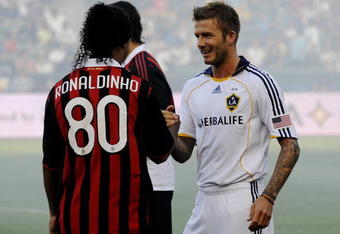 CARSON, CA - JULY 19:  David Beckham #23 of the Los Angeles Galaxy greets former teammate Ronaldinho #80 of AC Milan before the MLS friendly match at The Home Depot Center on July 19, 2009 in Carson, California. (Photo by Kevork Djansezian/Getty Images)