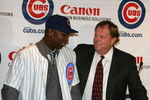 CHICAGO - NOVEMBER 30:  General manager Jim Hendry (R) of the Chicago Cubs introduces Alfonso Soriano #12 during a press conference to announce the sigining of Soriano to an eight year free agent contract November 30, 2006 at the Stadium Club at Wrigley Field in Chicago, Illinois.  (Photo by Chris Chambers/Getty Images)