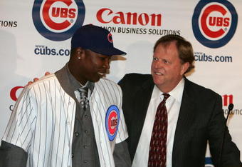 CHICAGO - NOVEMBER 30:  General manager Jim Hendry (R) of the Chicago Cubs introduces Alfonso Soriano #12 during a press conference to announce the sigining of Soriano to an eight year free agent contract November 30, 2006 at the Stadium Club at Wrigley Field in Chicago, Illinois.  (Photo by Chris Chambers/Getty Images)