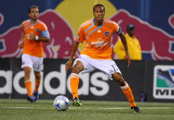 EAST RUTHERFORD, NJ - MAY 16:  Ricardo Clark #13 of the Houston Dynamo plays the ball against the New York Red Bulls at Giants Stadium in the Meadowlands on May 16, 2009 in East Rutherford, New Jersey. Houston and New York play to a 1-1 Tie.  (Photo by Mike Stobe/Getty Images for New York Red Bull)