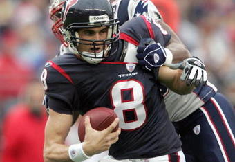 FOXBORO, MA - DECEMBER 17: David Carr #8 of the Houston Texans is sacked by Rosevelt Colvin #59 by the New England Patriots on December 17, 2006 at Gillette Stadium in Foxboro, Massachusetts. The New England Patriots defeated the Houston Texans 40-7. (Photo by Elsa/Getty Images)
