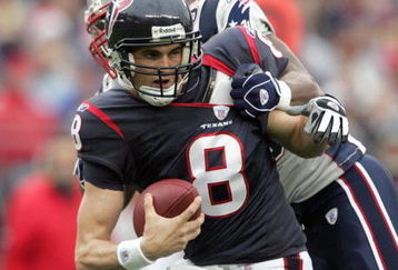FOXBORO, MA - DECEMBER 17: David Carr #8 of the Houston Texans is sacked by Rosevelt Colvin #59 by the New England Patriots on December 17, 2006 at Gillette Stadium in Foxboro, Massachusetts. The New England Patriots defeated the Houston Texans 40-7. (Photo by Elsa/Getty Images)