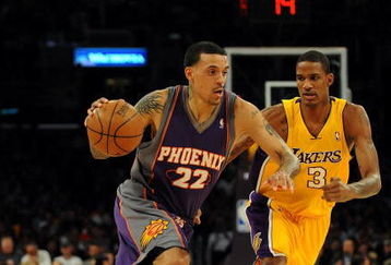 LOS ANGELES, CA - DECEMBER 10:  Matt Barnes #22 of the Phoenix Suns dribbles by Trevor Ariza #3 of the Los Angeles Lakers during the second half at the Staples Center on December, 10 2008 in Los Angeles, California.   NOTE TO USER: User expressly acknowledges and agrees that, by downloading and/or using this Photograph, user is consenting to the terms and conditions of the Getty Images License Agreement.  (Photo by Harry How/Getty Images)