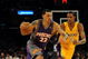 LOS ANGELES, CA - DECEMBER 10:  Matt Barnes #22 of the Phoenix Suns dribbles by Trevor Ariza #3 of the Los Angeles Lakers during the second half at the Staples Center on December, 10 2008 in Los Angeles, California.   NOTE TO USER: User expressly acknowledges and agrees that, by downloading and/or using this Photograph, user is consenting to the terms and conditions of the Getty Images License Agreement.  (Photo by Harry How/Getty Images)