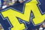 13 Oct 2001:  Michgan fans wave a giant flag to support their team against Purdue during the game at Michigan Stadium in Ann Arbor, Michigan.  Michigan beat Purdue 24-10. DIGITAL IMAGE. Mandatory Credit: Danny Moloshok/Allsport