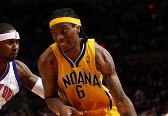 NEW YORK - FEBRUARY 23:  Marquis Daniels #6 of the Indiana Pacers drives to the basket past Larry Hughes #0 of the New York Knicks during the game at Madison Square Garden February 23, 2009 in New York City.  The Knicks won 123-119.  NOTE TO USER: User expressly acknowledges and agrees that, by downloading and/or using this Photograph, User is consenting to the terms and conditions of the Getty Images License Agreement.  (Photo by Chris McGrath/Getty Images)