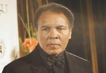 BERLIN, GERMANY - DECEMBER 17:  Boxing legend Muhammad Ali holds the Otto Hahn Peace Medal (Otto Hahn Friedensmedaille) during the award presentation on December 17, 2005 in Berlin, Germany. Ali is receiving the award for his involvement in the American peace movement. (Photo by Carsten Koall/Getty Images)  