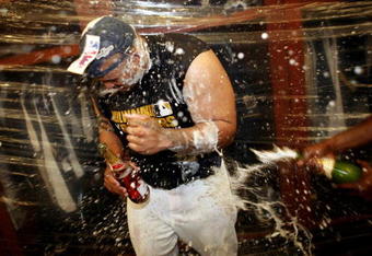 MILWAUKEE - SEPTEMBER 28:  Prince Fielder of the Milwaukee Brewers is sprayed by champaign in the locker room as he and the Brewers celebrate clinching the National League Wild Card after the game against the Chicago Cubs at Miller Park on September 28, 2008 in Milwaukee, Wisconsin. The Brewers defeated the Cubs 3-1.  (Photo by Darren Hauck/Getty Images)