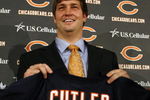 LAKE FOREST, IL - APRIL 3: Quarterback Jay Cutler of the Chicago Bears holds up his #6 jersey after he was introduced as their new quarterback during a press conference on April 3, 2009 at Halas Hall in Lake Forest, Illinois. (Photo by Jim Prisching/Getty Images)
