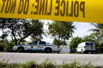 MIAMI - NOVEMBER 26:  Police cars are seen in front of the home where an intruder shot Washington Redskins football player Sean Taylor in the leg November 26, 2007 in Miami, Florida. The police continue to investigate what happened during the shooting around 1:45 in the morning at the home in the Miami suburb of Palmetto Bay.  (Photo by Joe Raedle/Getty Images)