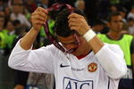 ROME - MAY 27:  Cristiano Ronaldo of Manchester United takes of his medal after Manchester United lost the UEFA Champions League Final match between Barcelona and Manchester United at the Stadio Olimpico on May 27, 2009 in Rome, Italy. Barcelona won 2-0. (Photo by Alex Livesey/Getty Images)