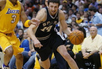 LOS ANGELES - MAY 11:  Hidayet Turkoglu #14 of the San Antonio Spurs drives on Devean George #3 of the Los Angeles Lakers in Game four of the Western Conference Semifinals during the 2004 NBA Playoffs at Staples Center on May 11, 2004 in Los Angeles, California.  The Lakers won 98-90.  NOTE TO USER: User expressly acknowledges and agrees that, by downloading and/or using this Photograph, user is consenting to the terms and conditions of the Getty Images License Agreement. (Photo by Lisa Blumenfeld/Getty Images)