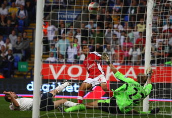 BOLTON, UNITED KINGDOM - SEPTEMBER 20:  Denilson of Arsenal scores his team's third goal past Jussi Jaaskelainen of Bolton Wanderers during the Barclays Premier League match between Bolton Wanderers and Arsenal at the Reebok Stadium on September 20, 2008 in Bolton, England.  (Photo by Phil Cole/Getty Images)