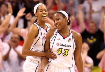 PHOENIX - JULY 18:  Tangela Smith #50 and Le'coe Willingham #43 of the Phoenix Mercury celebrate after scoring against the Detroit Shock during the final moments of the fourth quarter of the WNBA game at US Airways Center on July 18, 2009 in Phoenix, Arizona. The Mercury defeated the Shock 97-90.  NOTE TO USER: User expressly acknowledges and agrees that, by downloading and or using this photograph, User is consenting to the terms and conditions of the Getty Images License Agreement.  (Photo by Christian Petersen/Getty Images)