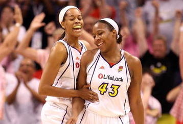 PHOENIX - JULY 18:  Tangela Smith #50 and Le'coe Willingham #43 of the Phoenix Mercury celebrate after scoring against the Detroit Shock during the final moments of the fourth quarter of the WNBA game at US Airways Center on July 18, 2009 in Phoenix, Arizona. The Mercury defeated the Shock 97-90.  NOTE TO USER: User expressly acknowledges and agrees that, by downloading and or using this photograph, User is consenting to the terms and conditions of the Getty Images License Agreement.  (Photo by Christian Petersen/Getty Images)