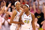 PHOENIX - JULY 18:  Tangela Smith #50 and Le'coe Willingham #43 of the Phoenix Mercury celebrate after scoring against the Detroit Shock during the final moments of the fourth quarter of the WNBA game at US Airways Center on July 18, 2009 in Phoenix, Arizona. The Mercury defeated the Shock 97-90.  NOTE TO USER: User expressly acknowledges and agrees that, by downloading and or using this photograph, User is consenting to the terms and conditions of the Getty Images License Agreement.  (Photo by Christian Petersen/Getty Images)