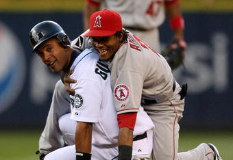 SEATTLE  - MAY 21:  Franklin Gutierrez #21 of the Seattle Mariners and shortstop Erick Aybar #2 of the Los Angeles Angels of Anaheim share a laugh after Gutierrez was put out at second on a fielders choice on May 21, 2009 in Seattle, Washington. (Photo by Otto Greule Jr/Getty Images)