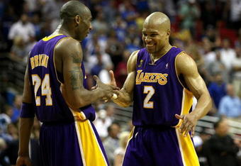 ORLANDO, FL - JUNE 11:  Kobe Bryant #24 and Derek Fisher #2 of the Los Angeles Lakers celebrate in the final moments of the Lakers' overtime win over the Orlando Magic in Game Four of the 2009 NBA Finals on June 11, 2009 at Amway Arena in Orlando, Florida.  NOTE TO USER:  User expressly acknowledges and agrees that, by downloading and or using this photograph, User is consenting to the terms and conditions of the Getty Images License Agreement.  (Photo by Elsa/Getty Images)