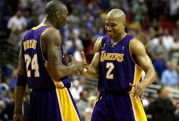 ORLANDO, FL - JUNE 11:  Kobe Bryant #24 and Derek Fisher #2 of the Los Angeles Lakers celebrate in the final moments of the Lakers' overtime win over the Orlando Magic in Game Four of the 2009 NBA Finals on June 11, 2009 at Amway Arena in Orlando, Florida.  NOTE TO USER:  User expressly acknowledges and agrees that, by downloading and or using this photograph, User is consenting to the terms and conditions of the Getty Images License Agreement.  (Photo by Elsa/Getty Images)