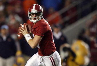 TUSCALOOSA, AL - NOVEMBER 29:  Quarterback Greg McElroy #12 of the Alabama Crimson Tide rolls out to pass against the Auburn Tigers at Bryant-Denny Stadium on November 29, 2008 in Tuscaloosa, Alabama. Alabama defeated Auburn 36-0.  (Photo by Doug Benc/Getty Images)