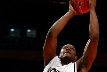 NEW YORK - MARCH 10:  Mac Koshwal #13 of the DePaul Blue Demons defends the shot of Yancy Gates #34 of the Cincinnati Bearcats during the first round of the Big East Tournament at Madison Square Garden on March 10, 2009 in New York City.  (Photo by Chris McGrath/Getty Images)