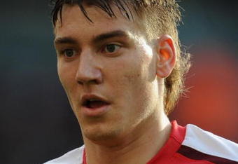 LONDON - NOVEMBER 08:  Nicklas Bendtner of Arsenal wears a shirt with an embroidered Rememberance Poppy during the Barclays Premier League match between Arsenal and Manchester United at the Emirates Stadium on November 8, 2008 in London, England.  (Photo by Shaun Botterill/Getty Images)