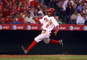 ANAHEIM, CA - JULY 07:  Erick Aybar #2 of the Los Angeles Angels of Anaheim prepares to slide across home plate against the Texas Rangers at Angel Stadium on July 7, 2009 in Anaheim, California.  (Photo by Jeff Gross/Getty Images)