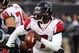 PHILADELPHIA - DECEMBER 31:  Michael Vick #7 of the Atlanta Falcons looks to pass against the Philadelphia Eagles in NFL action December 31, 2006 at Lincoln Financial Field in Philadelphia, Pennsylvania. The Eagles won 24-17.  (Photo by Jim McIsaac/Getty Images)