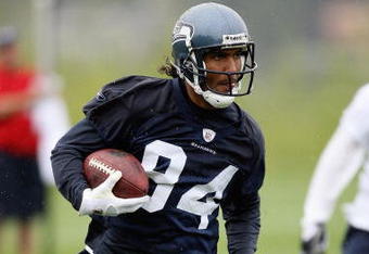 RENTON, WA - MAY 2:  T.J. Houshmandzadeh #84 of the Seattle Seahawks runs with the ball during minicamp at the Seahawks training facility on May 2, 2009 in Renton, Washington. (Photo by Otto Greule Jr/Getty Images) 