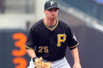 NEW YORK - MAY 09:  Adam LaRoche #25 of the Pittsburgh Pirates plays the field against the New York Mets on May 9, 2009 at Citi Field in the Flushing neighborhood of the Queens borough of New York City. The Mets defeated the Pirates 10-1.  (Photo by Jim McIsaac/Getty Images)