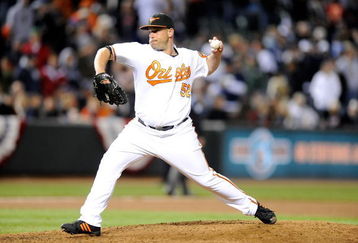 BALTIMORE - APRIL 8:  George Sherrill #52 of the Baltimore Orioles pitches against the New York Yankees at Camden Yards April 8, 2009 in Baltimore, Maryland.  (Photo by Greg Fiume/Getty Images)