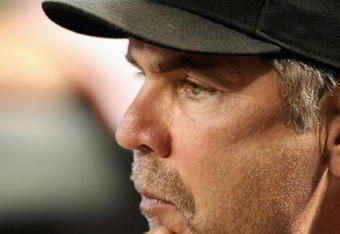PHOENIX - JUNE 11:  Manager Bruce Bochy of the San Francisco Giants signals a play during the major league baseball game against the Arizona Diamondbacks at Chase Field on June 11, 2009 in Phoenix, Arizona.  (Photo by Christian Petersen/Getty Images)
