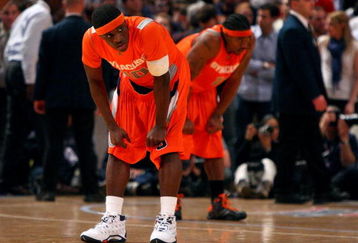 NEW YORK - MARCH 12:  Jonny Flynn #10 and Paul Harris #11 of the Syracuse Orange look on during the 4th overtime against the Connecticut Huskies during the quarterfinals of the Big East Tournament at Madison Square Garden on March 12, 2009 in New York City.  (Photo by Jim McIsaac/Getty Images)
