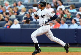 NEW YORK - JULY 20:  Derek Jeter #2 of the New York Yankees runs against the Baltimore Orioles on July 20, 2009 at Yankee Stadium in the Bronx borough of New York City.  (Photo by Jim McIsaac/Getty Images)